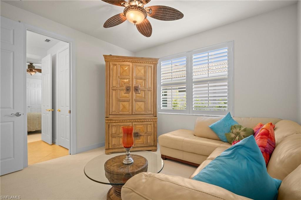 19415 La Serena Drive Estero, FL 33967 - Photo 28 of 49 a living room with furniture and a large window