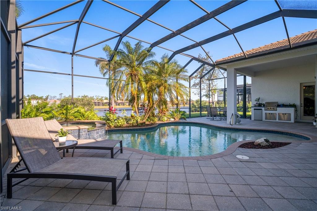 19415 La Serena Drive Estero, FL 33967 - Photo 32 of 49 a view of a swimming pool with a patio
