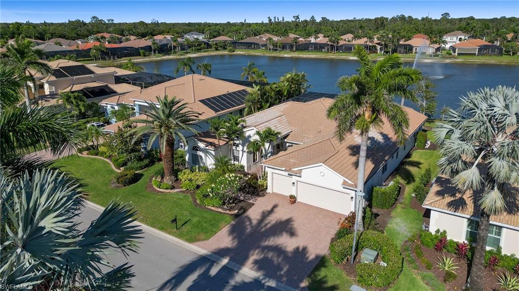 19415 La Serena Drive Estero, FL 33967 - Photo 38 of 49 an aerial view of lake residential house with outdoor space and trees