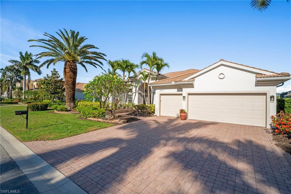19415 La Serena Drive Estero, FL 33967 - Photo 44 of 49 a view of a house with a yard and potted plants