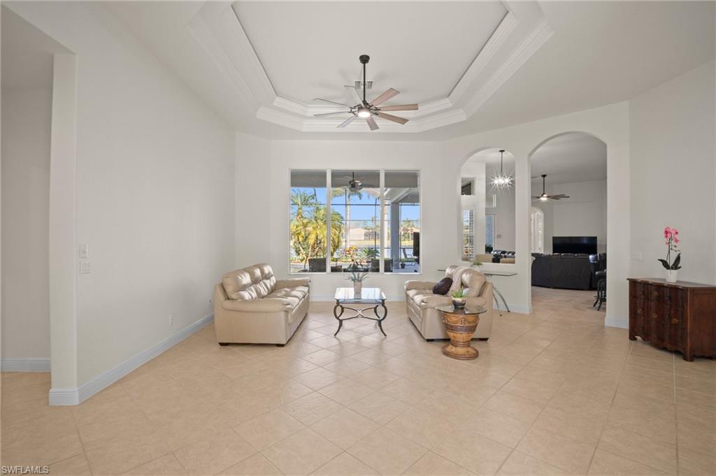 19415 La Serena Drive Estero, FL 33967 - Photo 6 of 49 a living room with furniture chandelier and a window