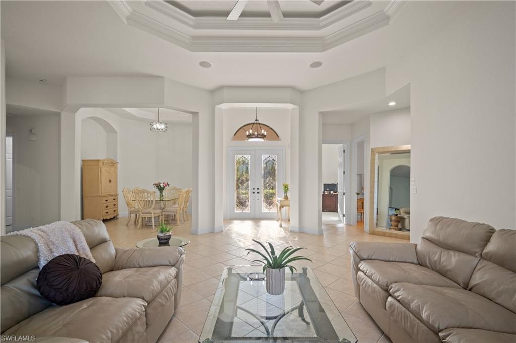 19415 La Serena Drive Estero, FL 33967 - Photo 7 of 49 a living room with furniture and a large window