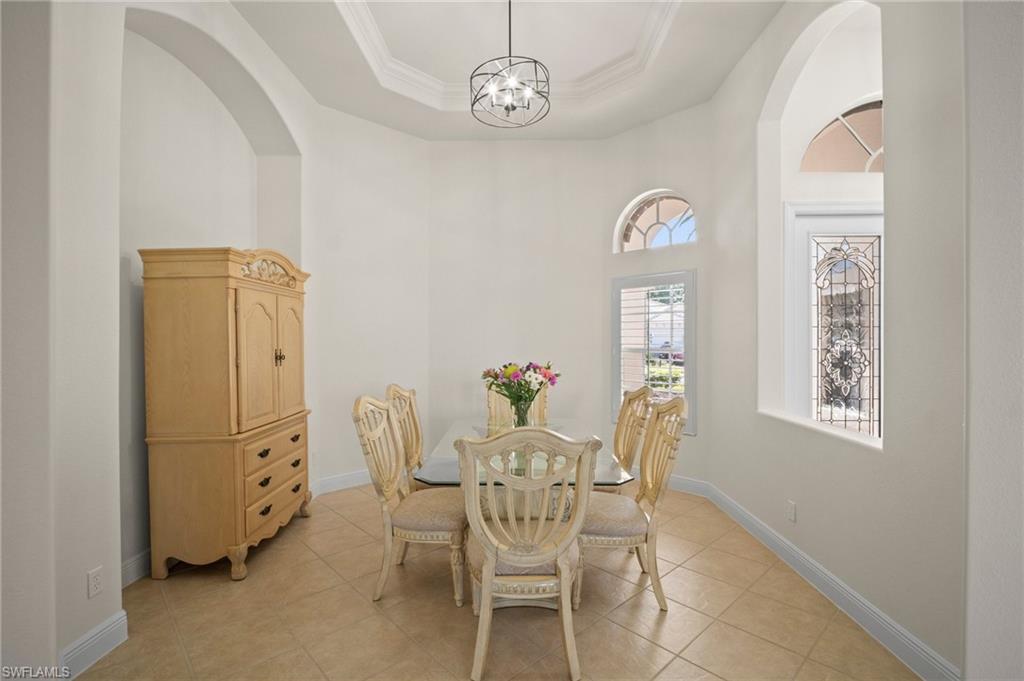 19415 La Serena Drive Estero, FL 33967 - Photo 8 of 49 a view of a dining room with furniture and chandelier