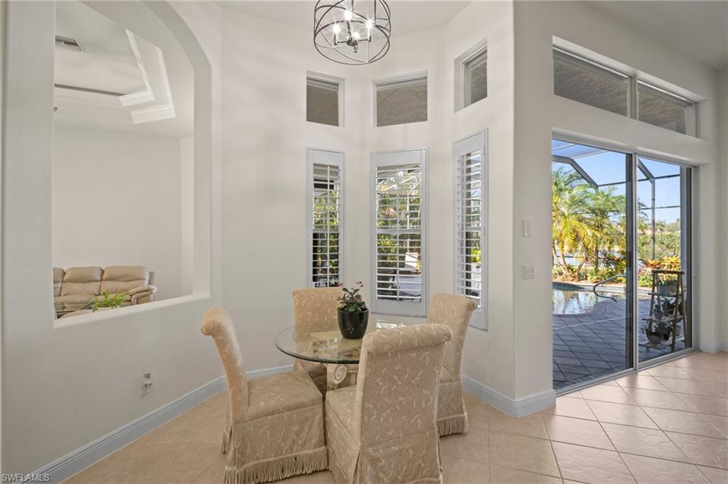 19415 La Serena Drive Estero, FL 33967 - Photo 9 of 49 a view of a dining room with furniture and a large window