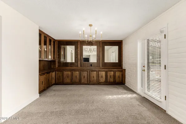 a view of a kitchen with a sink cabinets and a floor to ceiling window