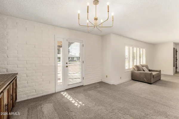 a view of an empty room with a fireplace