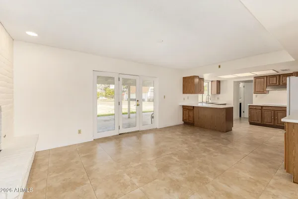 a kitchen with granite countertop cabinets and window