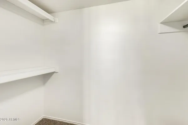 a livingroom with furniture and closet