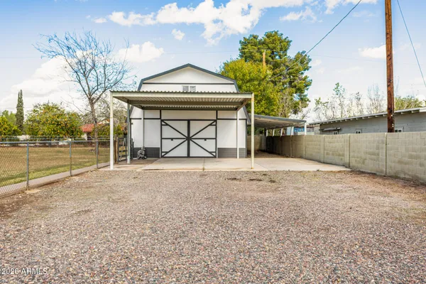 a view of a house with a outdoor space and garage