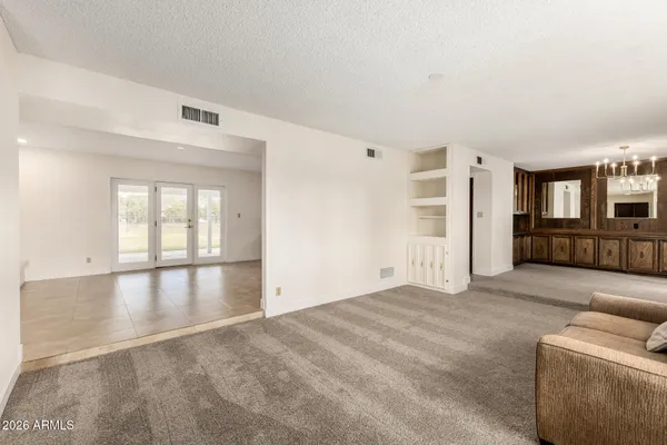 a living room with furniture and a window