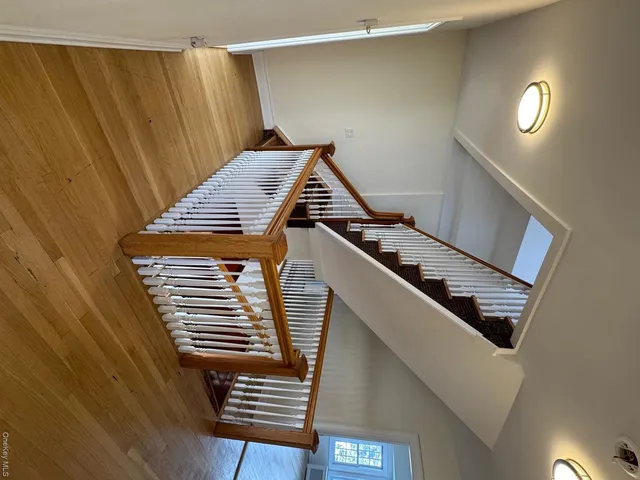 a view of staircase with white walls and a stairs