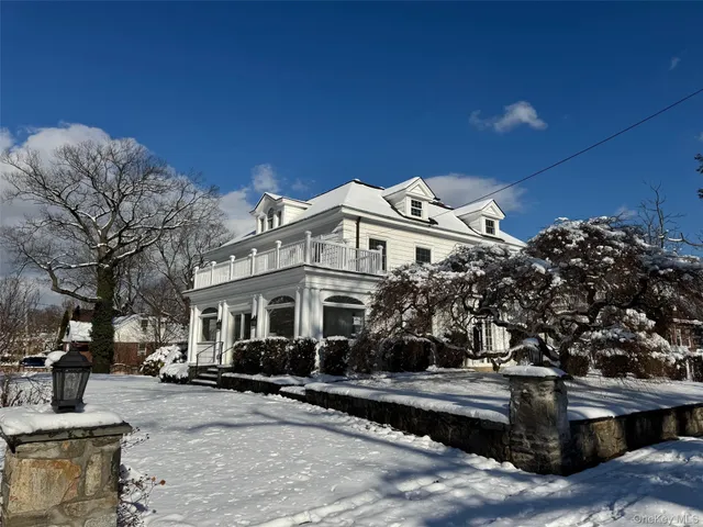 a view of a house with a tree