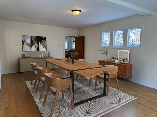 a dining room with a table and chairs