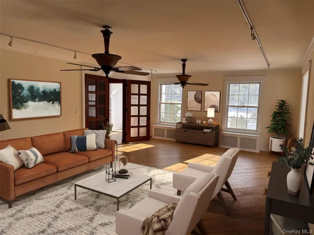 a living room with furniture a window and a chandelier