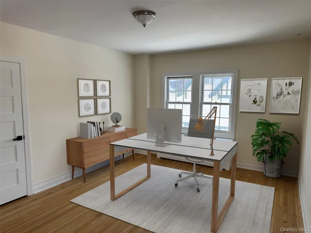 a workspace with furniture window and wooden floor