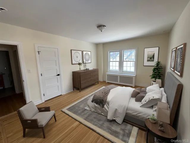 a bedroom with furniture and a window
