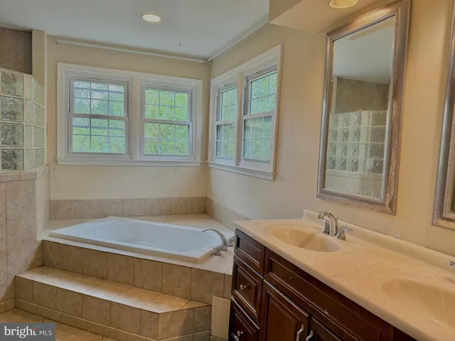 a bathroom with a sink and a bathtub