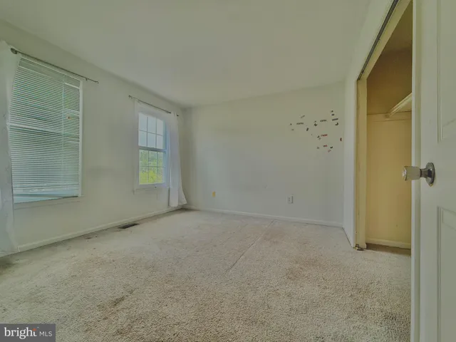 a bathroom with a double vanity sink toilet and shower