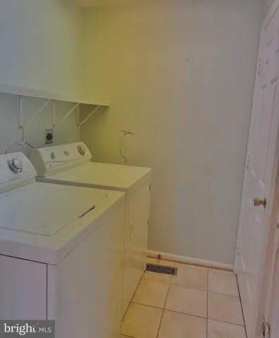 a view of a wooden deck with trees