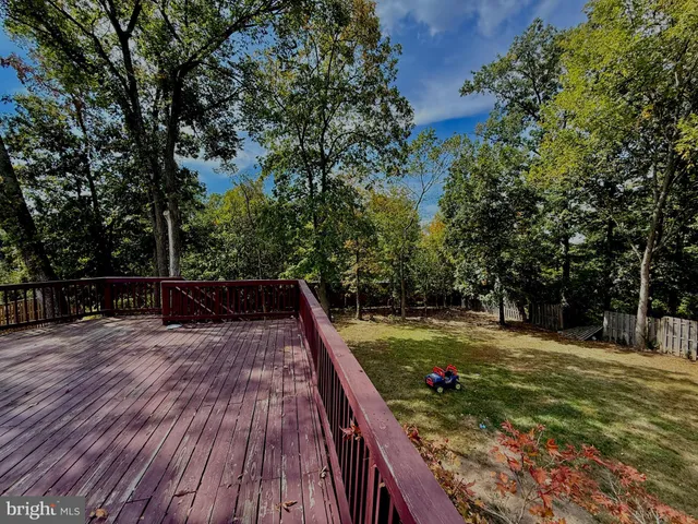 a view of a backyard with sitting area
