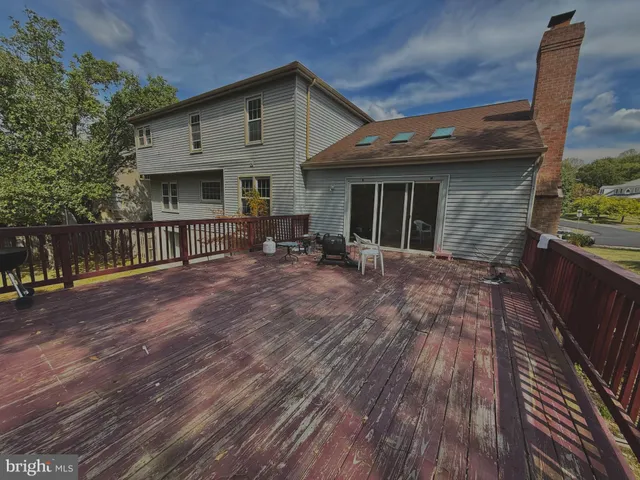 a backyard of a house with yard and outdoor seating