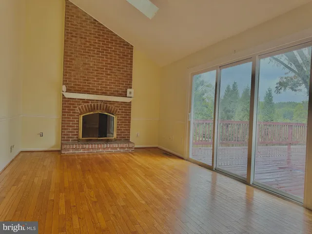 a view of an empty room with glass door