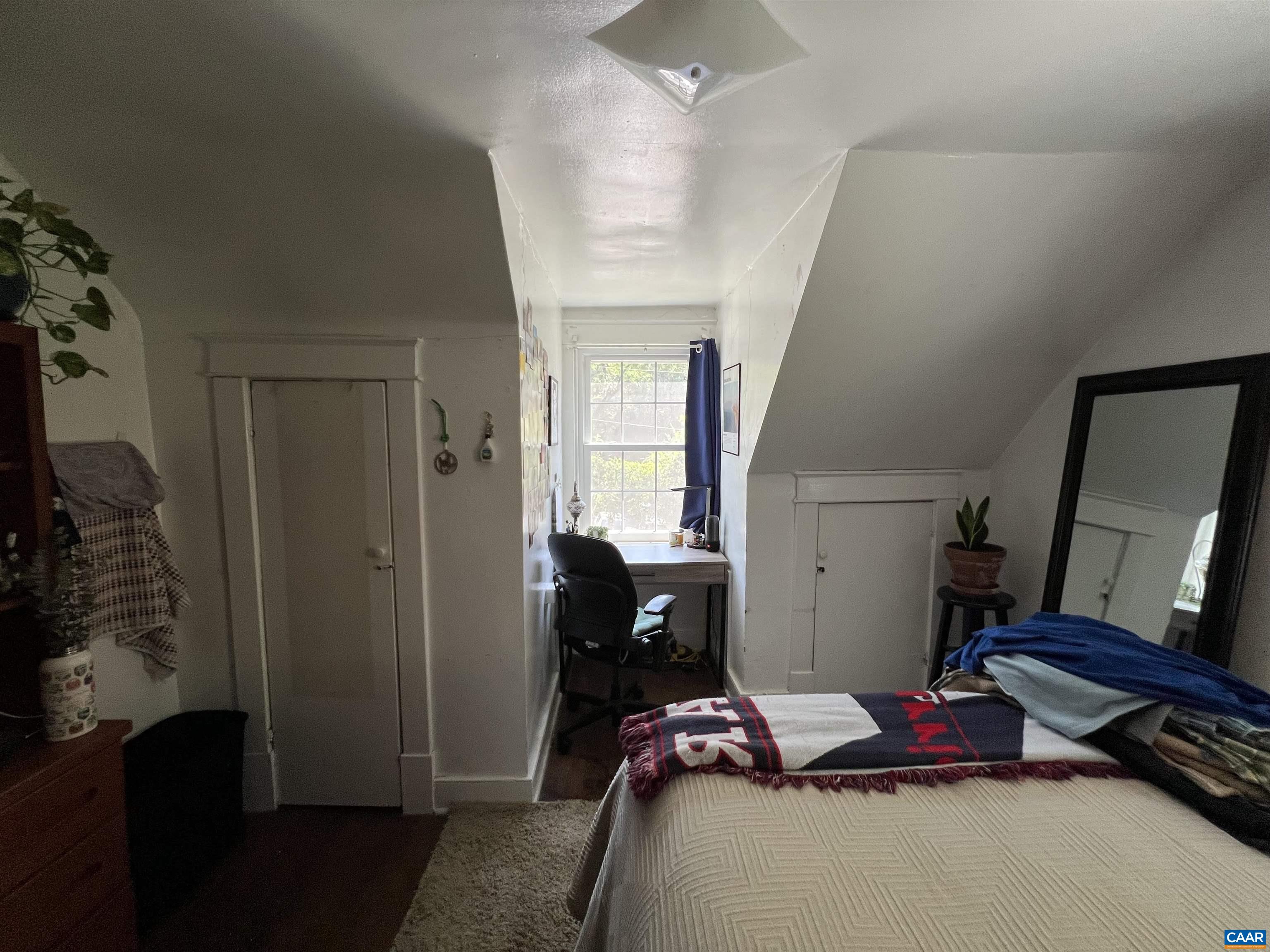 513 Valley Road Charlottesville, VA 22903 - Photo 12 of 22 a bedroom with a bed and wooden floor