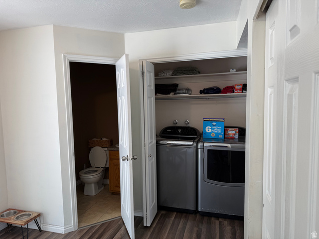 183 East 820 South Centerville, UT 84014 - Photo 6 of 14 Convenient laundry closet with built-in shelving, featuring wood-finish flooring