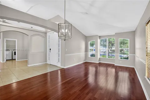 a kitchen with stainless steel appliances granite countertop a sink counter space and stove