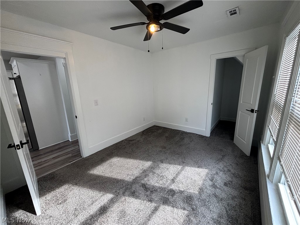 4115 Whitman Avenue, Unit UP Cleveland, OH 44113 - Photo 7 of 12 Unfurnished bedroom featuring carpet floors and ceiling fan