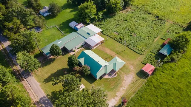 an aerial view of residential house with outdoor space