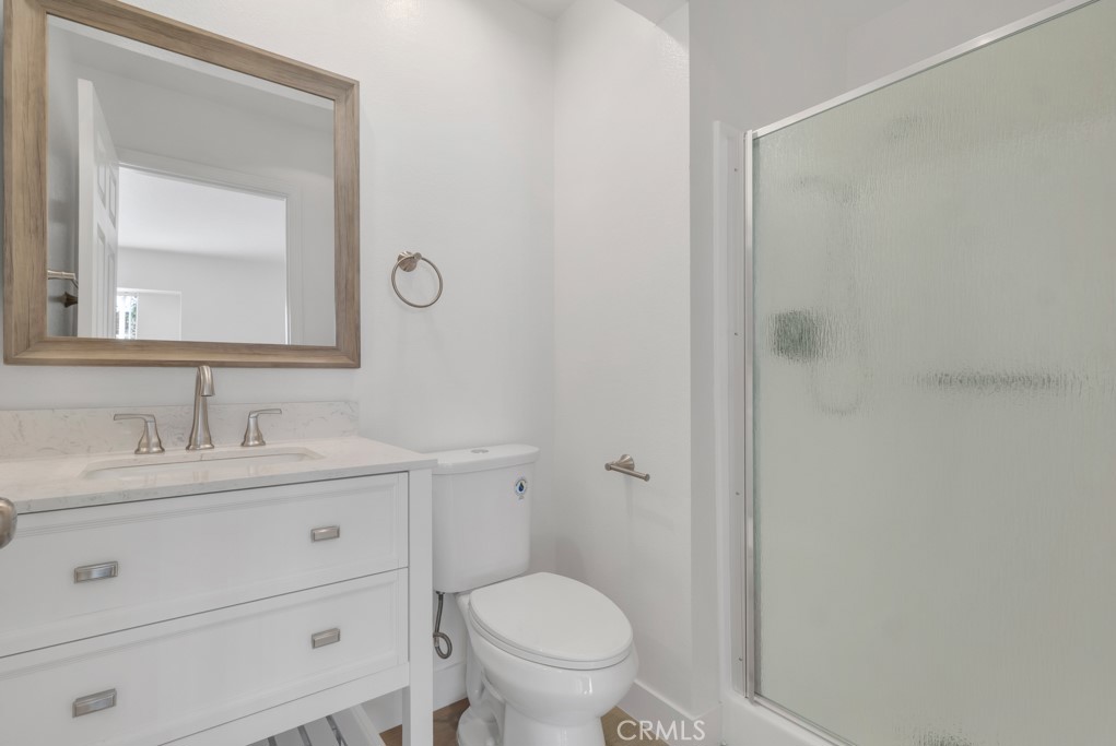 4201 Las Virgenes Road, Unit 206 Calabasas, CA 91302 - Photo 23 of 44 a bathroom with a toilet a sink a vanity and mirror