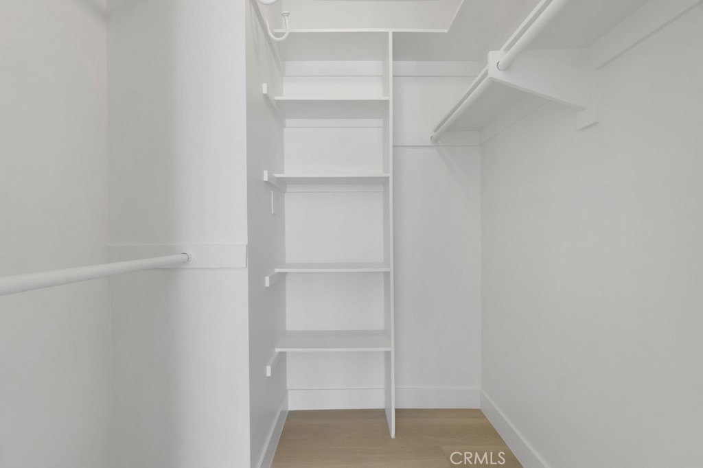 4201 Las Virgenes Road, Unit 206 Calabasas, CA 91302 - Photo 25 of 44 a view of walk in closet with empty racks