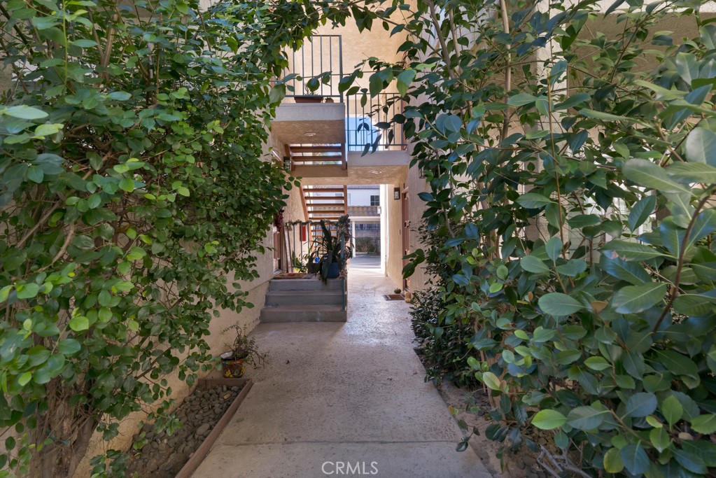 4201 Las Virgenes Road, Unit 206 Calabasas, CA 91302 - Photo 36 of 44 a pathway of a house with a yard and plants