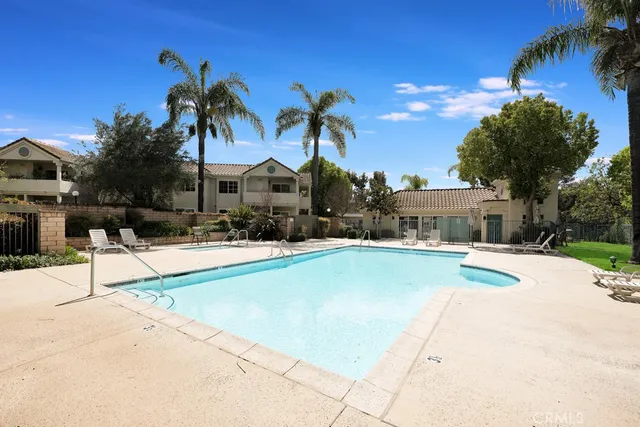 a view of a patio with swimming pool