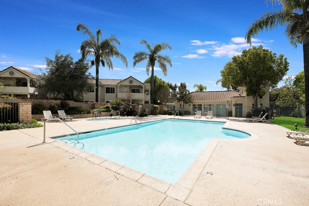 4201 Las Virgenes Road, Unit 206 Calabasas, CA 91302 - Photo 38 of 44 a view of a patio with swimming pool table and chairs
