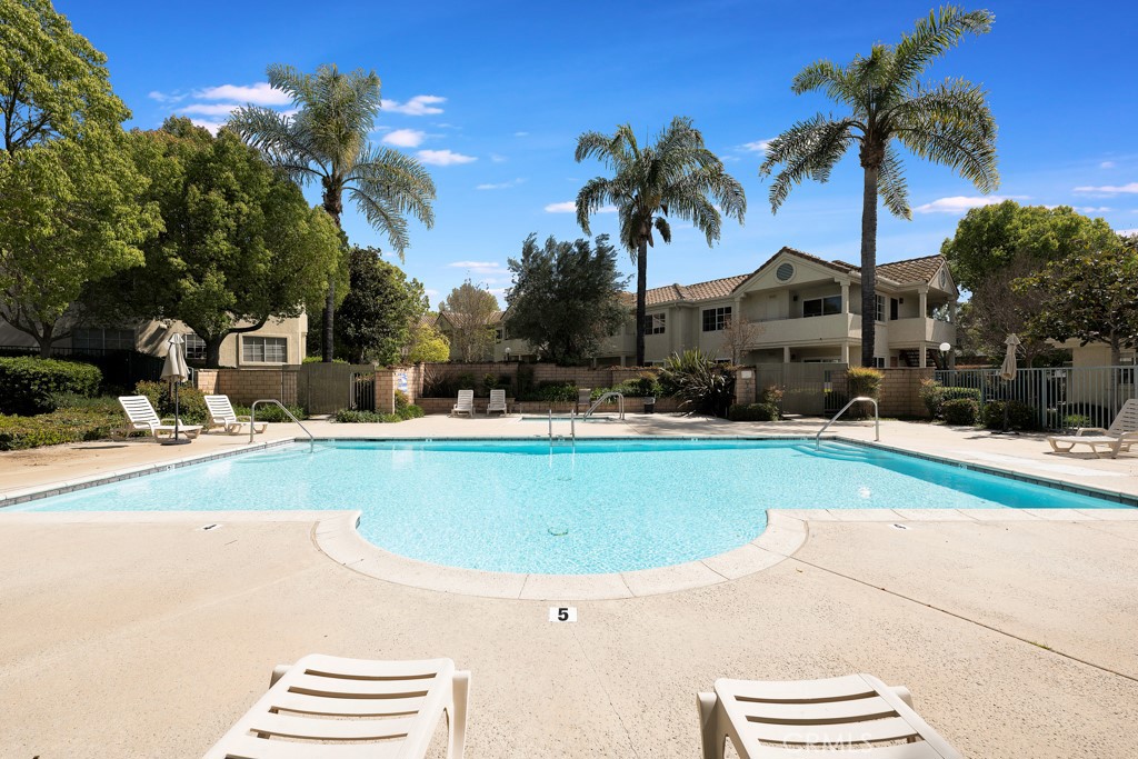 4201 Las Virgenes Road, Unit 206 Calabasas, CA 91302 - Photo 39 of 44 a swimming pool with outdoor seating and yard