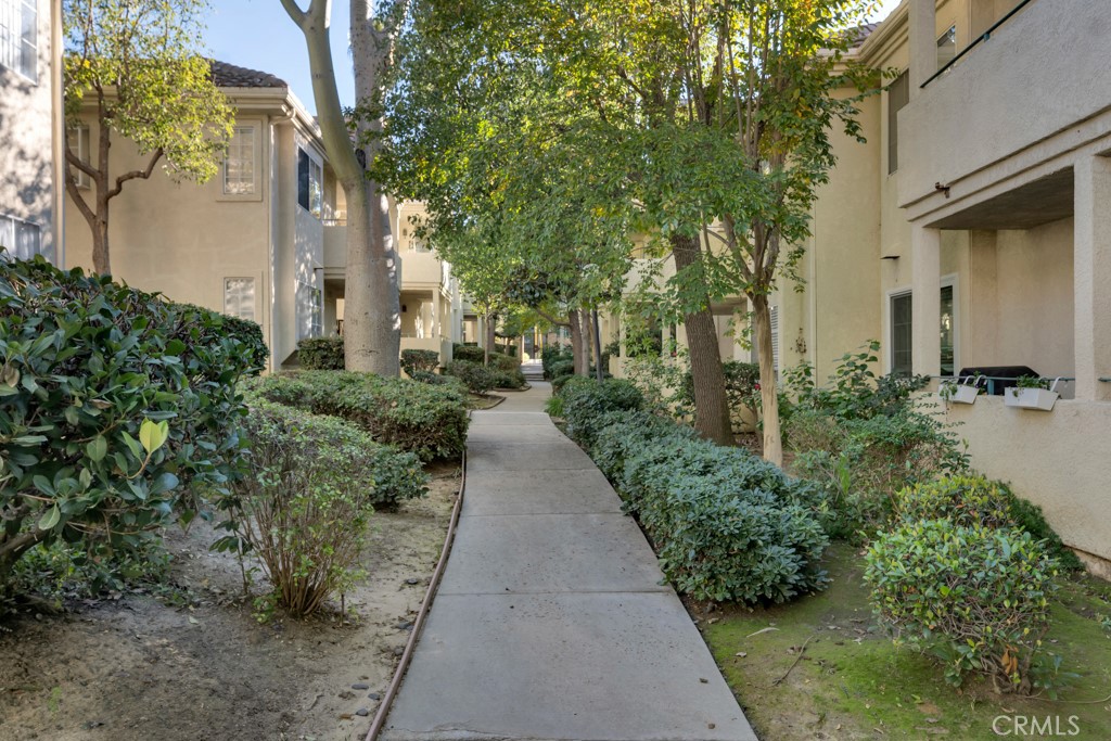 4201 Las Virgenes Road, Unit 206 Calabasas, CA 91302 - Photo 4 of 44 a view of a pathway with house on both side