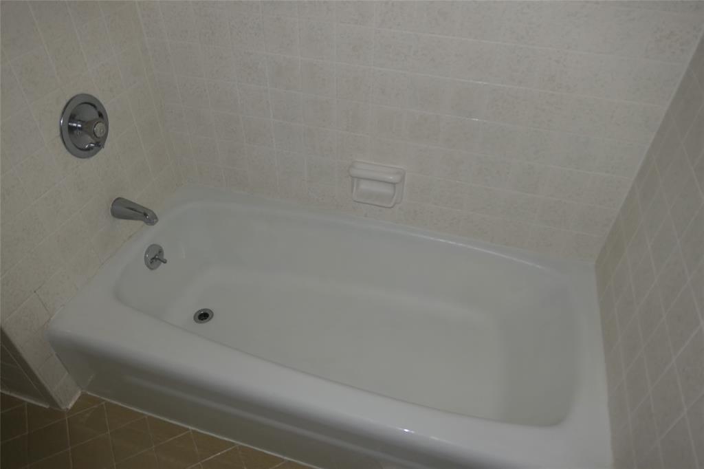 6317 Rincon Way Dallas, TX 75214 - Photo 22 of 32 a bathroom with a shower