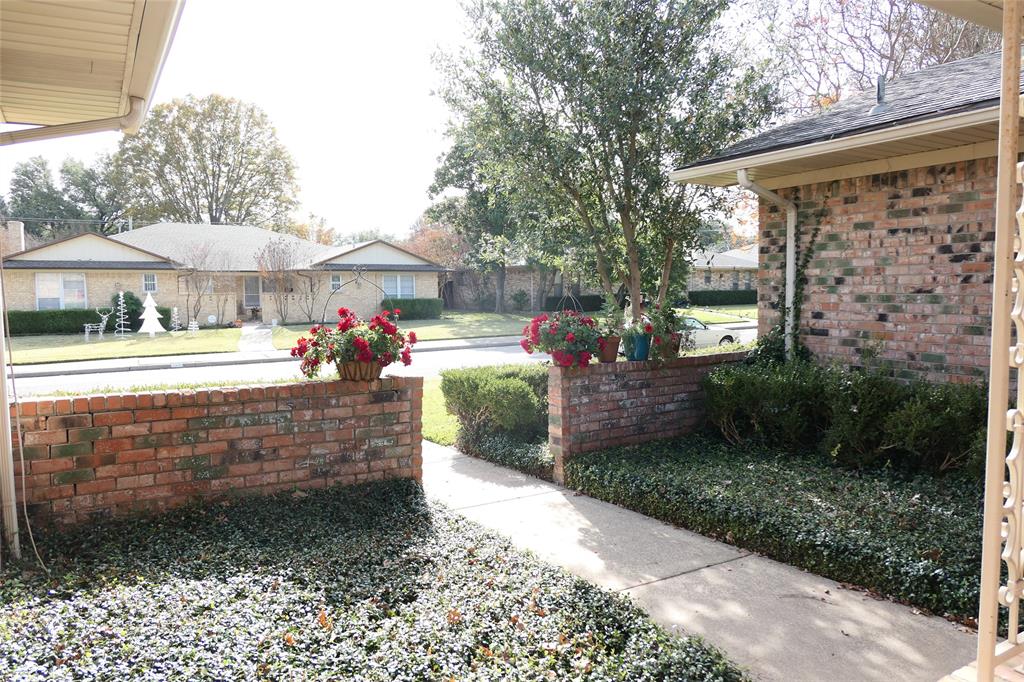 6317 Rincon Way Dallas, TX 75214 - Photo 5 of 32 a view of a porch with furniture and garden