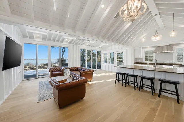 a large kitchen with a table and chairs