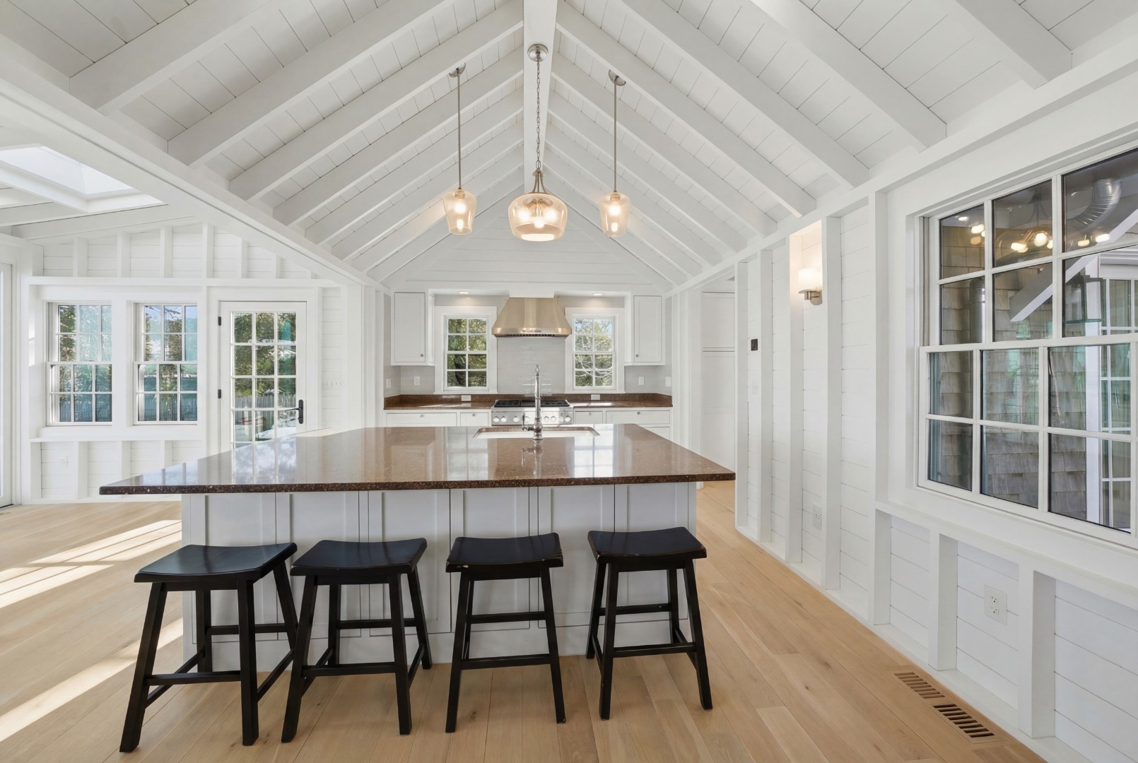 10 Fowler Avenue Edgartown, MA 02539 - Photo 5 of 20 a large kitchen with a table and chairs