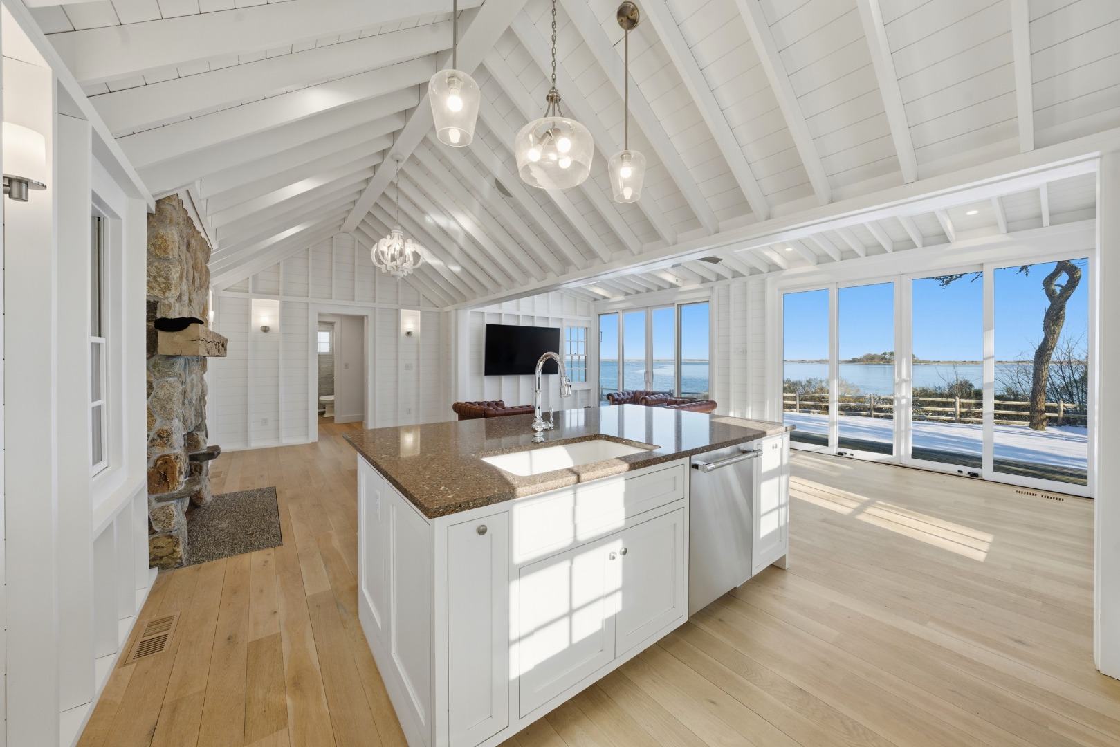 10 Fowler Avenue Edgartown, MA 02539 - Photo 6 of 20 a large kitchen with kitchen island a large counter space a sink appliances and cabinets