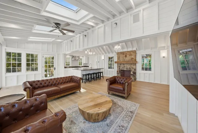 a bed room with a bed and a large window