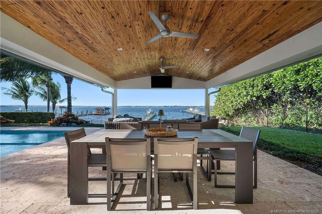 1433 Southeast Riverside Drive Stuart, FL 34996 - Photo 31 of 64 a view of a patio with swimming pool