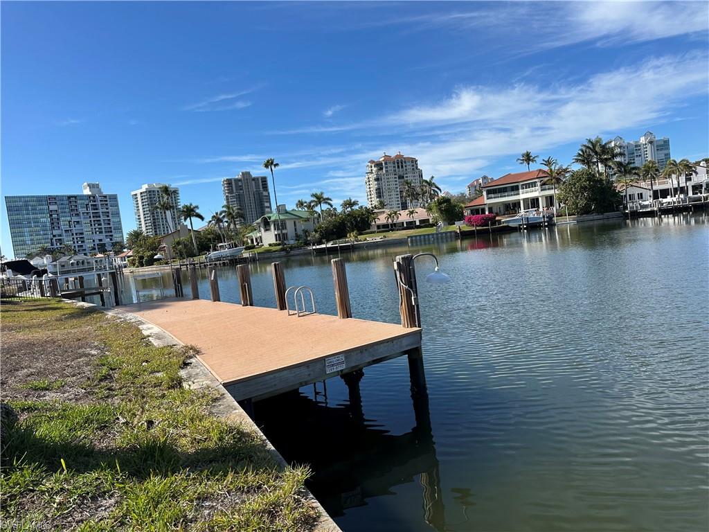 341 Devils Bight Naples, FL 34103 - Photo 12 of 16 a terrace with outdoor seating and city view