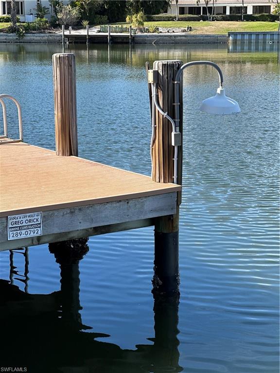 341 Devils Bight Naples, FL 34103 - Photo 13 of 16 a view of a lake with a outdoor space