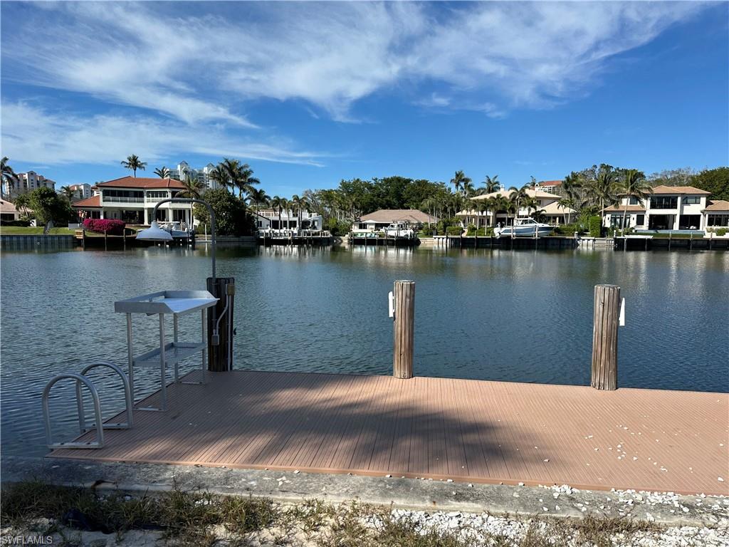 341 Devils Bight Naples, FL 34103 - Photo 16 of 16 a view of a lake