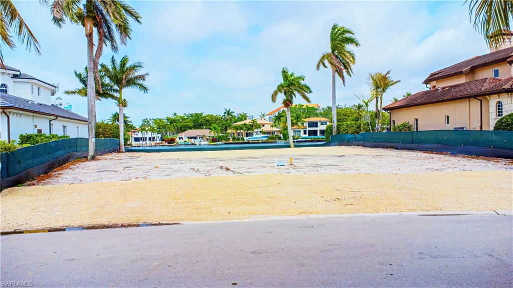 341 Devils Bight Naples, FL 34103 - Photo 8 of 16 a view of a street with palm trees