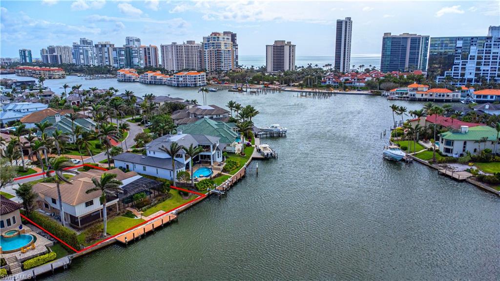 341 Devils Bight Naples, FL 34103 - Photo 10 of 16 a view of a city with tall buildings